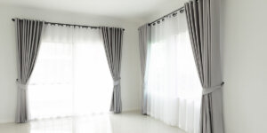 Curtains and drapes on large window, ideal for spacious interiors