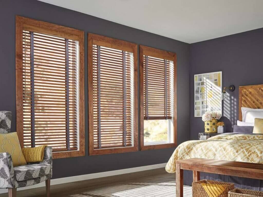 Genuine wood blinds are beautiful and sturdy but may require more careful maintenance, especially in humid environments.