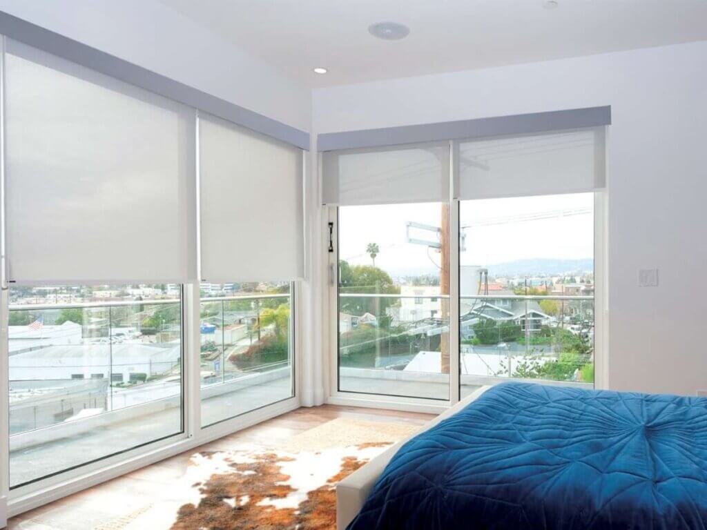 Norman Soluna Roller Shades in Sliding Door Bedroom