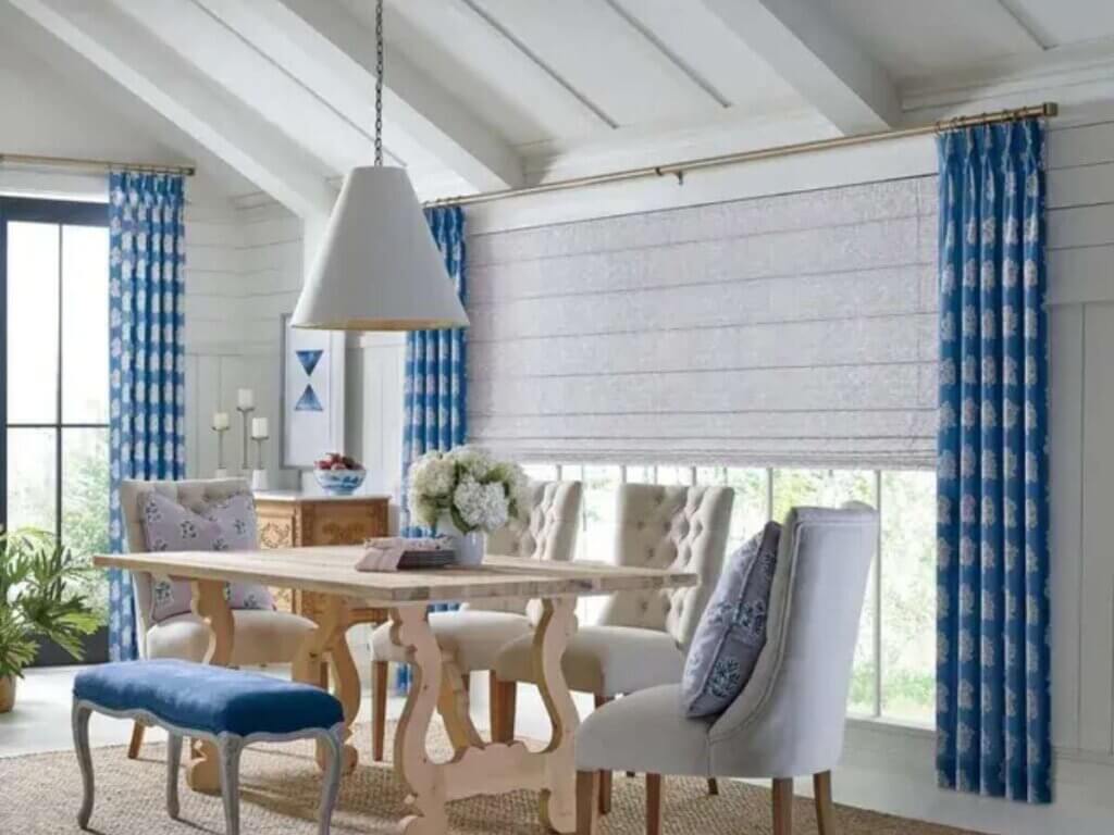 Pairing Roman shades with curtains can create a polished, layered look that combines the benefits of both window treatments.