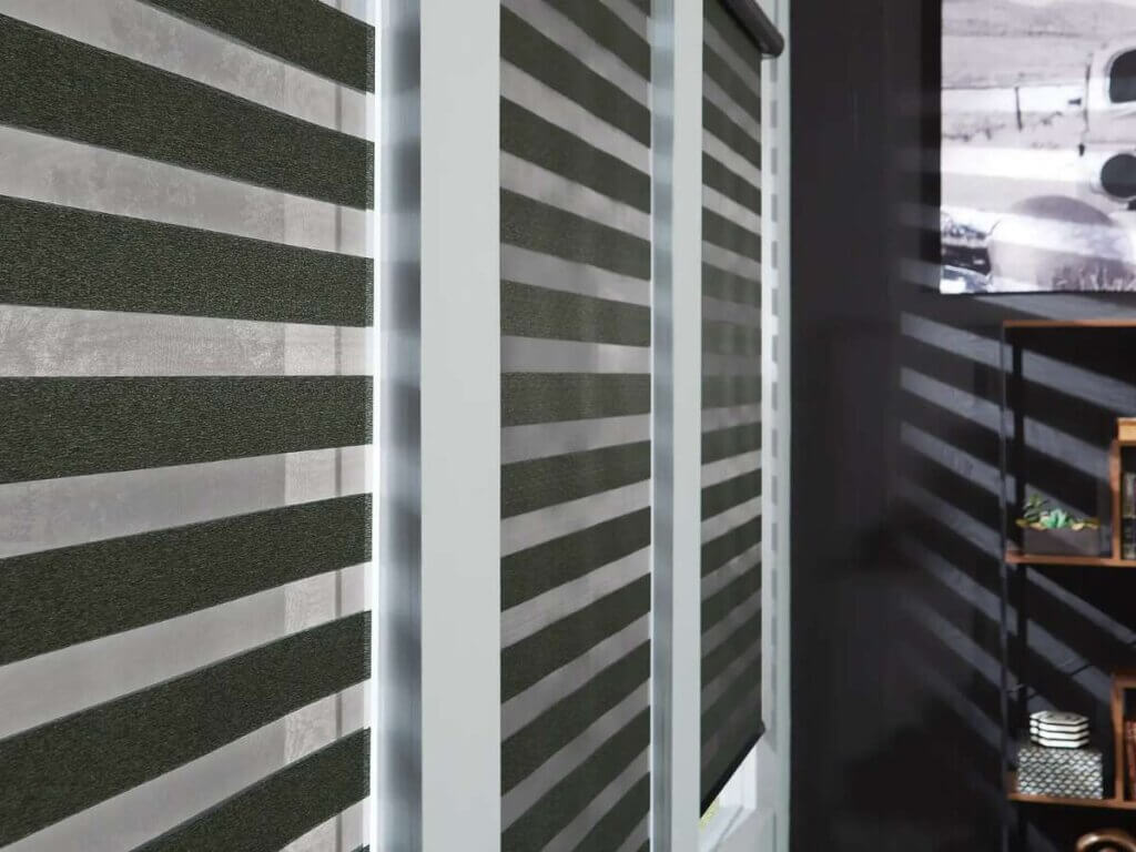 Blackout zebra shades are a modern and versatile window treatment that combines both sheer and opaque fabric stripes, offering excellent control over light and privacy.