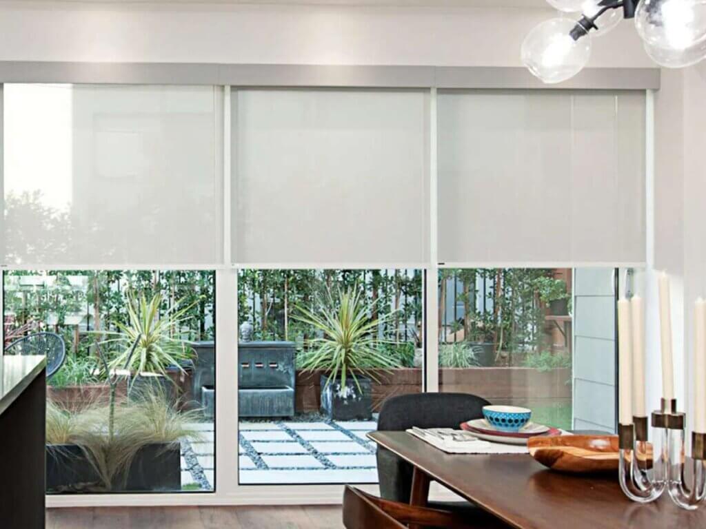 Norman Roller Shades in a dining room
