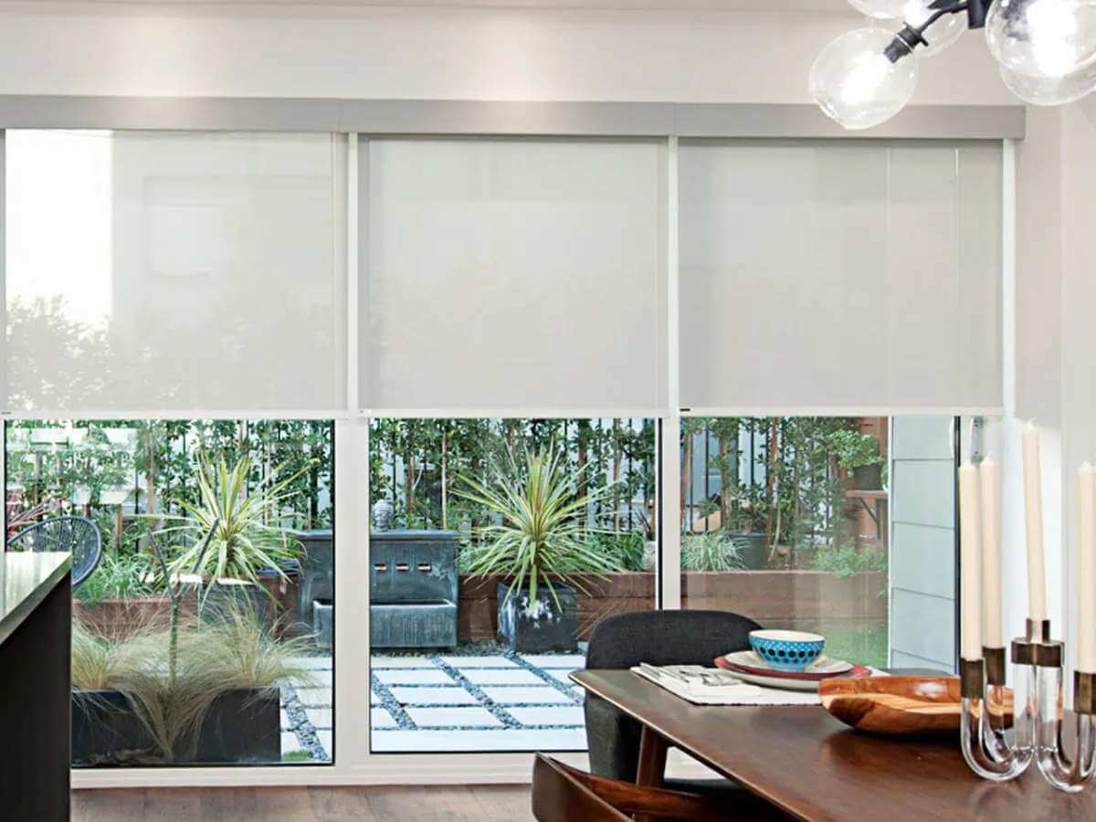 Norman Roller Shades in a dining room