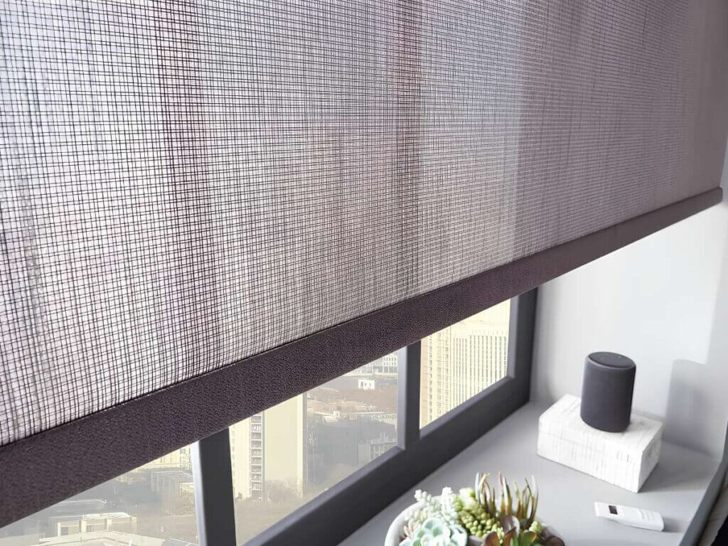 This is a photo of a motorized solar shades